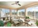 Bright sunroom featuring lots of windows, comfortable seating, and decor at 9740 Wardley Dr, Charlotte, NC 28215