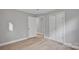 A bedroom featuring modern floors, neutral walls, and closet space at 1008 Bose Ave, Rock Hill, SC 29732