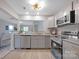 Modern kitchen featuring gray cabinets, granite countertops, stainless steel appliances and hardwood floors at 1008 Bose Ave, Rock Hill, SC 29732