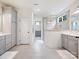 Bright bathroom with double sink vanity, linen closet and walk-in shower at 10521 Ardley Manor Dr, Mint Hill, NC 28227
