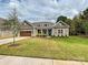 Charming single-story home featuring a well-manicured lawn and inviting facade at 10521 Ardley Manor Dr, Mint Hill, NC 28227