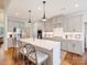 Modern kitchen with stainless steel appliances, pendant lighting, and a large center island with seating at 10521 Ardley Manor Dr, Mint Hill, NC 28227