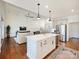 Bright kitchen with stainless steel appliances and a spacious island with a breakfast bar at 10521 Ardley Manor Dr, Mint Hill, NC 28227