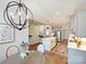 Open concept kitchen and living area with stainless steel appliances and a large island at 10521 Ardley Manor Dr, Mint Hill, NC 28227