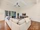 Cozy living room with hardwood floors, comfortable seating, and sliding glass doors to an outdoor space at 10521 Ardley Manor Dr, Mint Hill, NC 28227