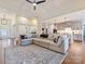 Spacious open-concept living room, kitchen, and dining area with hardwood floors and neutral color palette at 10521 Ardley Manor Dr, Mint Hill, NC 28227