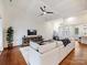 Bright living room with hardwood floors, coffered ceilings, and large comfortable sofa at 10521 Ardley Manor Dr, Mint Hill, NC 28227