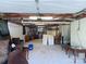 Spacious unfinished basement with visible ceiling beams, concrete floors, and white block walls at 108 W Jefferson St, York, SC 29745
