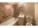 Standard bathroom featuring tile, combination tub and shower, sink, and toilet at 108 W Jefferson St, York, SC 29745
