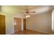 Cozy bedroom featuring hardwood floors, a ceiling fan, and good closet space at 108 W Jefferson St, York, SC 29745