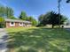 Charming brick home featuring a well-maintained front yard and a cozy front porch at 108 W Jefferson St, York, SC 29745