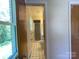 Hallway view to bathroom with tiled floor and a walk-in shower at 108 W Jefferson St, York, SC 29745