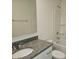 Bathroom showcasing granite countertop vanity, large mirror, and tub with shower at 112 Brook Creek Dr, Troutman, NC 28166
