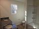 Bathroom featuring a granite countertop, double sink vanity, and a tub with shower at 112 Brook Creek Dr, Troutman, NC 28166