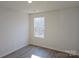 A bright bedroom with wood floors and a window that offers great natural light at 112 Brook Creek Dr, Troutman, NC 28166