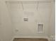 A laundry room featuring white walls and vinyl flooring at 112 Brook Creek Dr, Troutman, NC 28166