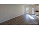 Living space featuring white walls and vinyl flooring at 112 Brook Creek Dr, Troutman, NC 28166