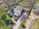 A bird's eye view of a charming home with a gravel driveway and covered parking at 12 Church St, York, SC 29745
