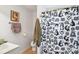 Bathroom with vanity, sink, toilet and kid-themed shower curtain at 12 Church St, York, SC 29745