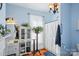 Bathroom featuring a shower with curtain, plants and blue walls at 12 Church St, York, SC 29745