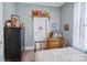 Cozy bedroom with charming decor, featuring a classic armoire, wooden dresser and inviting natural light at 12 Church St, York, SC 29745