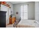 Bedroom with white walls, wooden dresser, and iron bed frame at 12 Church St, York, SC 29745