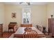 Cozy dining room features ample light, hardwood floors, and wood furniture at 12 Church St, York, SC 29745