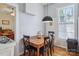 Inviting dining area features a wooden table, black chairs, and a modern pendant light at 12 Church St, York, SC 29745