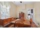 Open dining room with hardwood floors and access to kitchen for seamless serving at 12 Church St, York, SC 29745