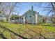 Quaint cottage-style home featuring a screened porch and lush, green lawn at 12 Church St, York, SC 29745