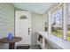 Charming front porch with classic white door, offering a glimpse of the neighborhood and a cozy welcome at 12 Church St, York, SC 29745