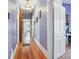 Hallway with hardwood floors, light purple walls and white trim at 12 Church St, York, SC 29745