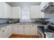 Charming kitchen with white cabinets, modern appliances, and plenty of counter space at 12 Church St, York, SC 29745