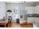 Bright kitchen featuring stainless steel appliances, white cabinets, and hardwood floors at 12 Church St, York, SC 29745