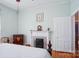 Bedroom featuring a fireplace and dresser at 12 Church St, York, SC 29745