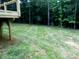Grassed backyard with a view of wooded area at 1202 Louise Ln, Albemarle, NC 28001