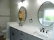 Bathroom with double sinks, marble countertop, and tile flooring at 1202 Louise Ln, Albemarle, NC 28001