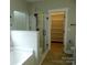 Bathroom featuring tub, walk-in shower, and walk-in closet at 1202 Louise Ln, Albemarle, NC 28001