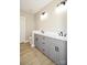 Modern bathroom boasts double vanity with gray cabinets and black hardware at 1202 Louise Ln, Albemarle, NC 28001