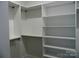 Walk-in closet with open shelving for optimal storage at 1202 Louise Ln, Albemarle, NC 28001