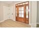Elegant front door with decorative glass panels, creating a grand entrance and welcoming ambiance at 1202 Louise Ln, Albemarle, NC 28001