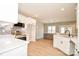 Well-equipped kitchen with white cabinets, stainless steel appliances, and an adjacent dining area at 1202 Louise Ln, Albemarle, NC 28001