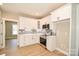 Modern kitchen featuring white cabinetry, stainless appliances, and a gray subway tile backsplash at 1202 Louise Ln, Albemarle, NC 28001