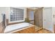 Bright bathroom featuring a tub, glass shower, and unique glass block window for natural light and privacy at 125 Whiterock Dr, Mount Holly, NC 28120