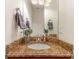 Powder room featuring granite countertop, an undermount sink and a decorative mirror at 125 Whiterock Dr, Mount Holly, NC 28120