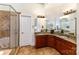 Bathroom with double sink vanity, granite counters, and glass enclosed tiled shower at 125 Whiterock Dr, Mount Holly, NC 28120