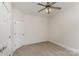 Bedroom with neutral decor features ceiling fan, carpet, and closet at 125 Whiterock Dr, Mount Holly, NC 28120