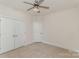 Bedroom with neutral decor features ceiling fan, carpet, and closet at 125 Whiterock Dr, Mount Holly, NC 28120