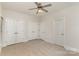 Bedroom with neutral decor features ceiling fan, neutral carpet, and closet at 125 Whiterock Dr, Mount Holly, NC 28120
