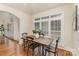 Cozy dining area with hardwood floors and windows featuring plantation shutters at 125 Whiterock Dr, Mount Holly, NC 28120